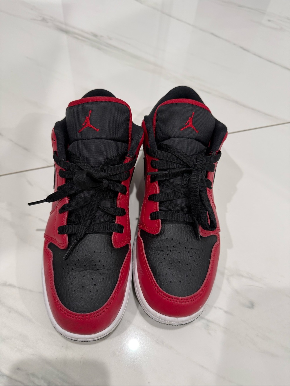 7 youth/Women’s 8.5 Jordan 1 low, red and black